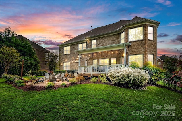 405 Five Leaf Ln, Waxhaw, NC 28173 - rear view of house with a patio, brick siding, and a lawn