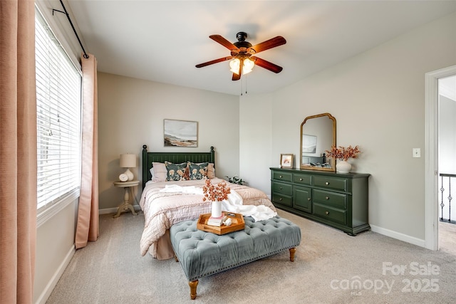 405 Five Leaf Ln, Waxhaw, NC 28173 - bedroom featuring light carpet, multiple windows, baseboards, and a ceiling fan