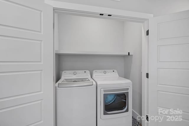 laundry room with independent washer and dryer and laundry area