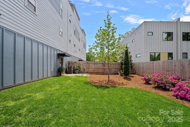 view of yard featuring a patio area and a fenced backyard