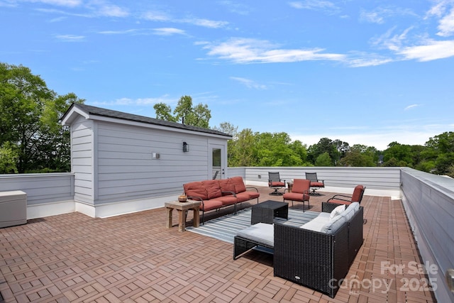 view of patio featuring outdoor lounge area and an outdoor structure