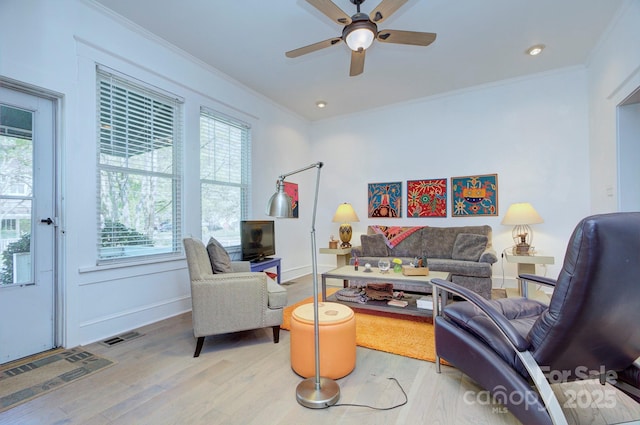 1000 E 35th St, Charlotte, NC 28205 - living room with light wood-type flooring, visible vents, crown molding, and a ceiling fan