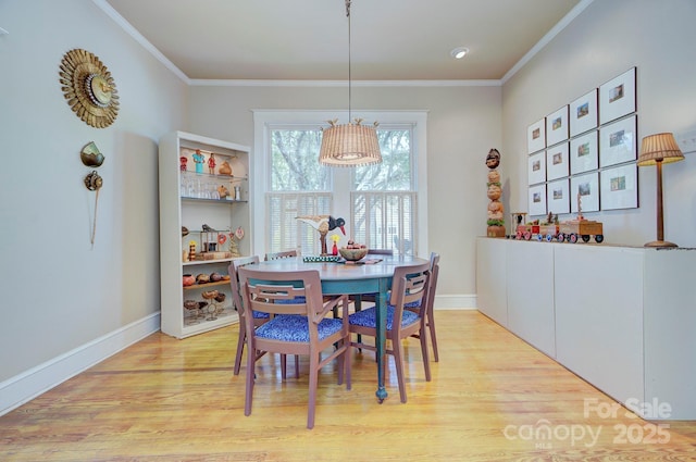 1000 E 35th St, Charlotte, NC 28205 - dining room with light wood-style flooring, baseboards, and ornamental molding