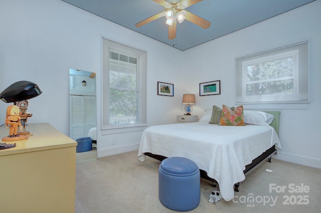 1000 E 35th St, Charlotte, NC 28205 - bedroom with light carpet, a ceiling fan, and baseboards