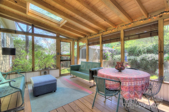 1000 E 35th St, Charlotte, NC 28205 - sunroom / solarium featuring beam ceiling, a skylight, outdoor dining space, and plenty of natural light