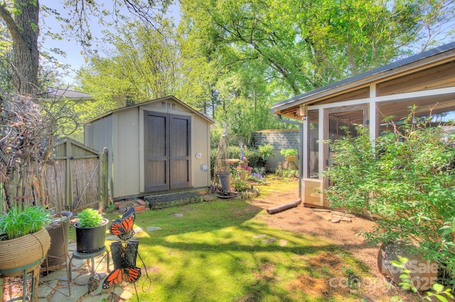 1000 E 35th St, Charlotte, NC 28205 - view of yard with an outdoor structure, a storage unit, and fence