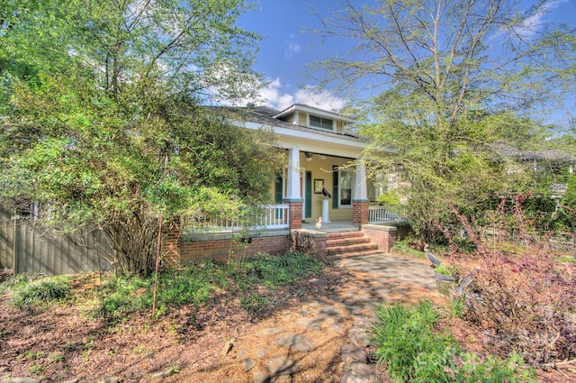 1000 E 35th St, Charlotte, NC 28205 - view of front of home featuring brick siding, a porch, and fence