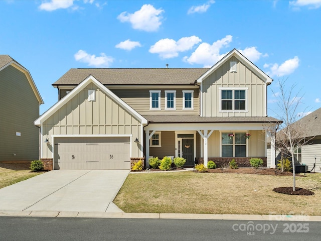 5532 Muckross Ln, Fort Mill, SC 29707 - view of front of house with concrete driveway, board and batten siding, a front lawn, an attached garage, and a porch