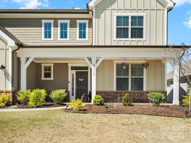 5532 Muckross Ln, Fort Mill, SC 29707 - view of front facade with board and batten siding, covered porch, and brick siding