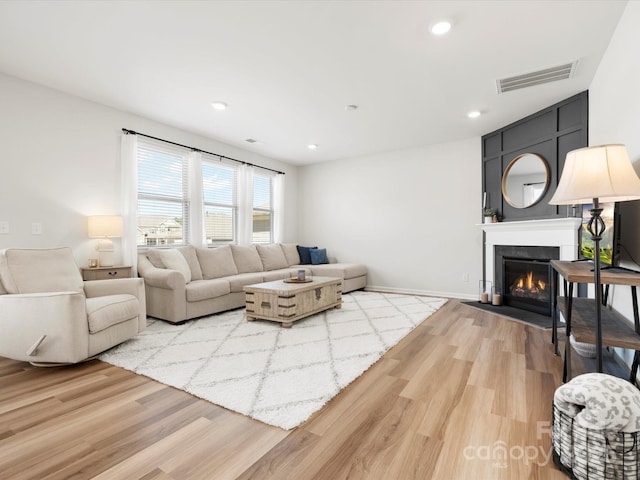 5532 Muckross Ln, Fort Mill, SC 29707 - living room featuring wood finished floors, a large fireplace, visible vents, and recessed lighting