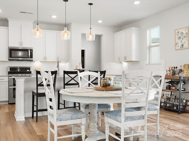 5532 Muckross Ln, Fort Mill, SC 29707 - dining room with light wood-style floors, recessed lighting, and visible vents