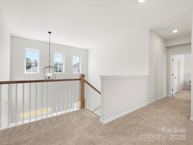 5532 Muckross Ln, Fort Mill, SC 29707 - hall with baseboards, an inviting chandelier, an upstairs landing, recessed lighting, and carpet flooring