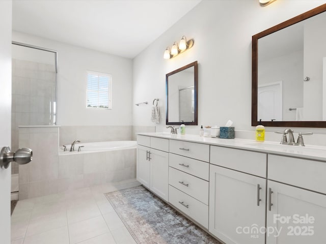 5532 Muckross Ln, Fort Mill, SC 29707 - bathroom with a garden tub, double vanity, a sink, and tile patterned flooring