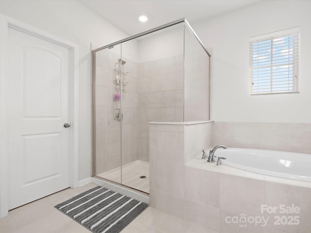 5532 Muckross Ln, Fort Mill, SC 29707 - full bathroom with tile patterned floors, recessed lighting, a stall shower, and a garden tub