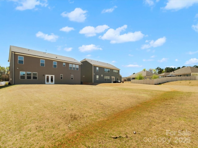 5532 Muckross Ln, Fort Mill, SC 29707 - rear view of property featuring french doors, fence, and a lawn