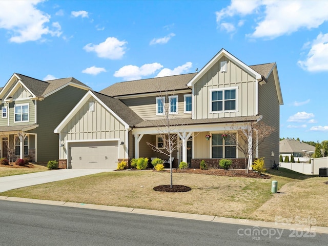 5532 Muckross Ln, Fort Mill, SC 29707 - craftsman-style house featuring an attached garage, board and batten siding, concrete driveway, and a front yard