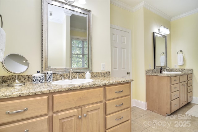 bathroom with tile patterned flooring, a sink, crown molding, and two vanities