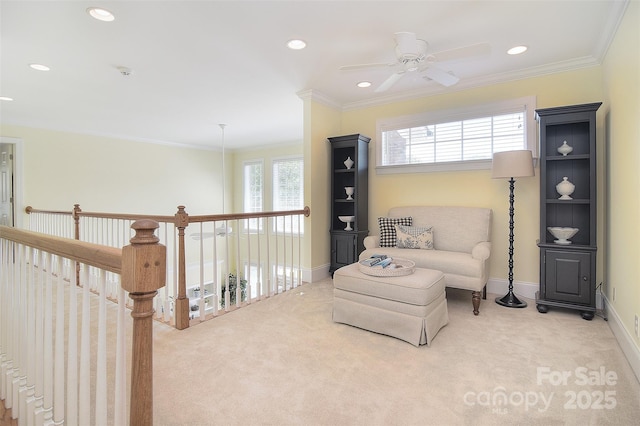 sitting room with baseboards, ornamental molding, recessed lighting, carpet flooring, and a ceiling fan