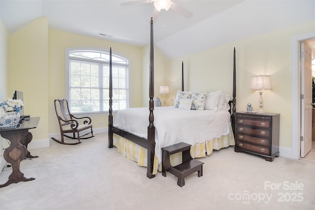 carpeted bedroom featuring visible vents, baseboards, a ceiling fan, and vaulted ceiling