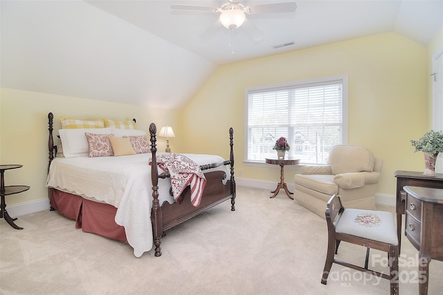 bedroom with light colored carpet, baseboards, vaulted ceiling, and visible vents