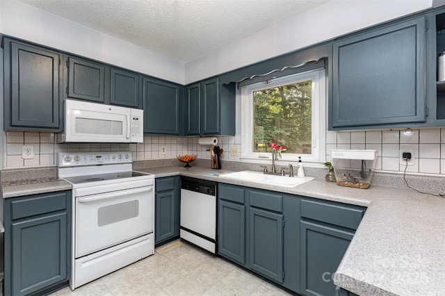 4813 Carving Tree Dr, Mint Hill, NC 28227 - kitchen featuring a sink, white appliances, light countertops, a textured ceiling, and tasteful backsplash