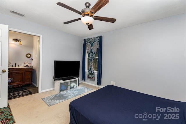 4813 Carving Tree Dr, Mint Hill, NC 28227 - carpeted bedroom with connected bathroom, baseboards, visible vents, and ceiling fan