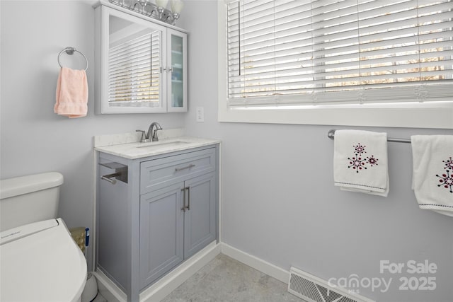 34 Turnberry Dr, Arden, NC 28704 - bathroom featuring concrete floors, vanity, baseboards, toilet, and visible vents