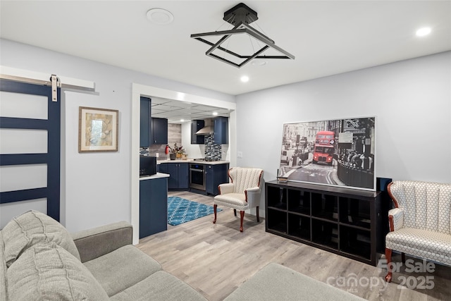 34 Turnberry Dr, Arden, NC 28704 - living room with light wood-type flooring, a barn door, and recessed lighting