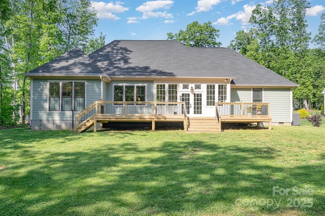back of house featuring a lawn, a wooden deck, roof with shingles, and crawl space