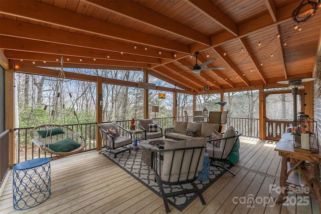7788 Parks Mountain Dr, Newland, NC 28657 - sunroom / solarium featuring an outdoor living space with a fire pit, ceiling fan, and healthy amount of natural light