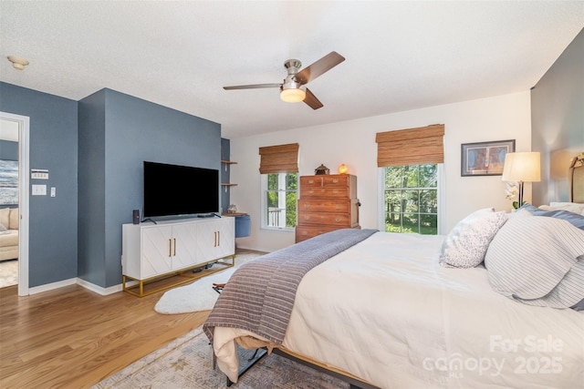 127 Fantasy Ln, Mooresville, NC 28117 - bedroom featuring wood finished floors, a ceiling fan, and baseboards