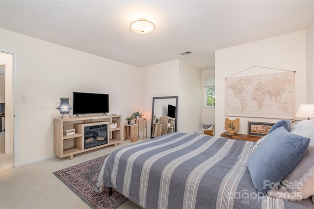 127 Fantasy Ln, Mooresville, NC 28117 - carpeted bedroom featuring a textured ceiling