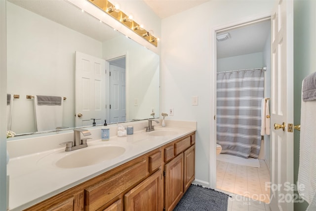 127 Fantasy Ln, Mooresville, NC 28117 - bathroom with double vanity, toilet, and a shower with curtain