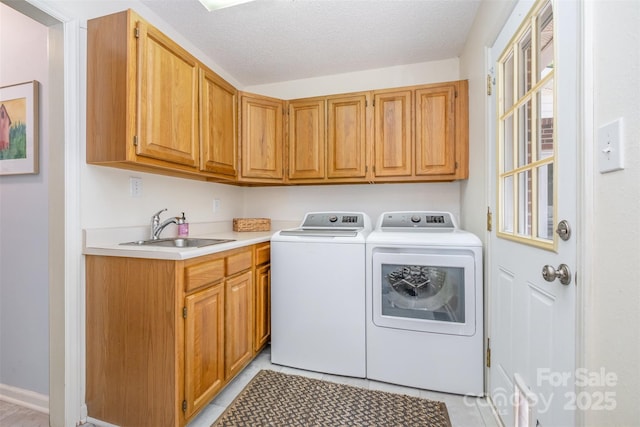 127 Fantasy Ln, Mooresville, NC 28117 - washroom with separate washer and dryer, cabinet space, light tile patterned floors, and a textured ceiling