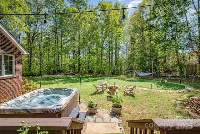127 Fantasy Ln, Mooresville, NC 28117 - view of grassy yard with a putting green and a hot tub