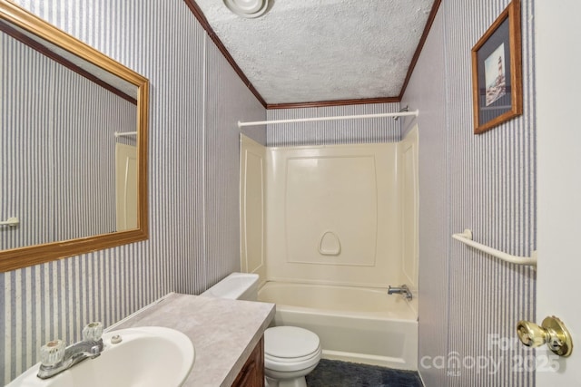 bathroom featuring wallpapered walls, ornamental molding, bathing tub / shower combination, a textured ceiling, and toilet