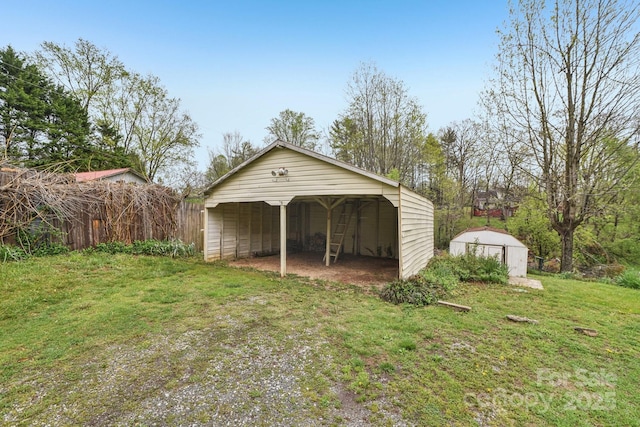 garage featuring a shed