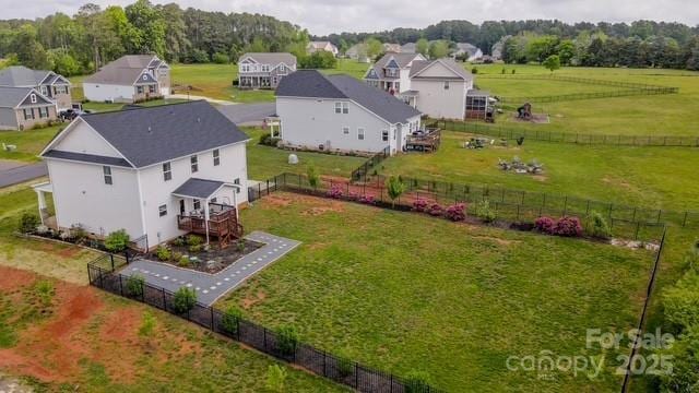 drone / aerial view featuring a rural view and a residential view