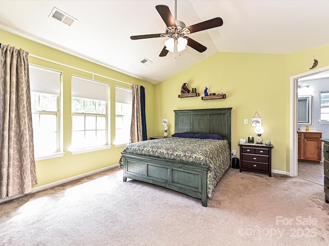 3914 Cassidy Dr, Waxhaw, NC 28173 - carpeted bedroom featuring vaulted ceiling, baseboards, ensuite bathroom, and ceiling fan
