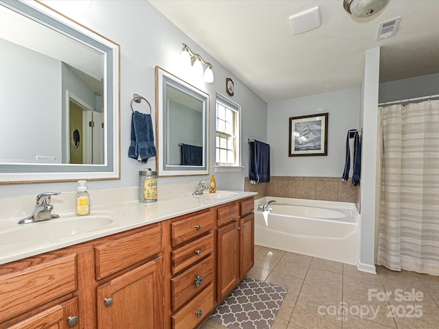 3914 Cassidy Dr, Waxhaw, NC 28173 - bathroom featuring tile patterned floors, double vanity, and a garden tub