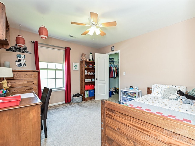 3914 Cassidy Dr, Waxhaw, NC 28173 - carpeted bedroom with a spacious closet, baseboards, a ceiling fan, a desk, and a closet