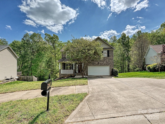 3914 Cassidy Dr, Waxhaw, NC 28173 - obstructed view of property with a porch, driveway, a front yard, an attached garage, and brick siding