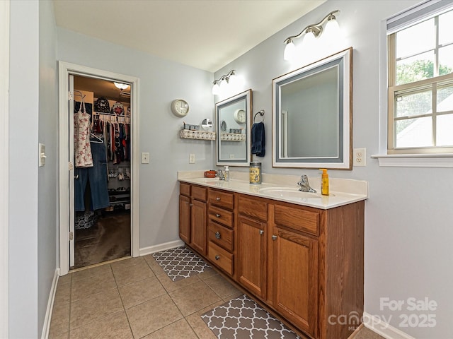 3914 Cassidy Dr, Waxhaw, NC 28173 - bathroom featuring double vanity, tile patterned flooring, and a spacious closet