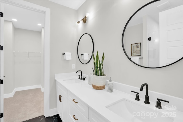 3449 Byrnes St, Charlotte, NC 28205 - full bath with double vanity, a walk in closet, baseboards, tile patterned flooring, and recessed lighting