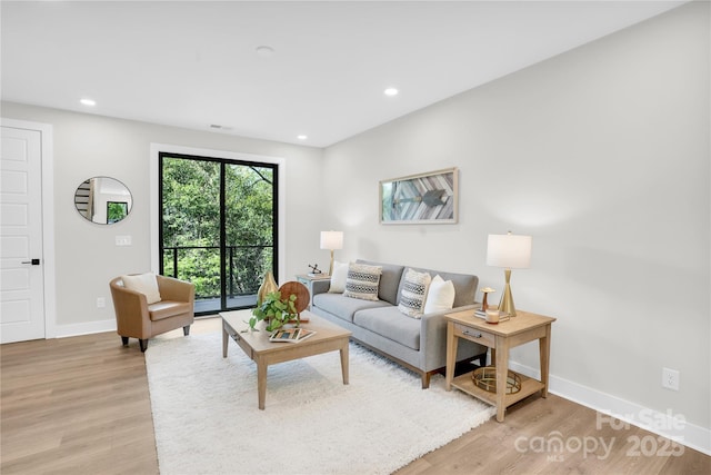 3449 Byrnes St, Charlotte, NC 28205 - living area featuring light wood-style floors, baseboards, and recessed lighting