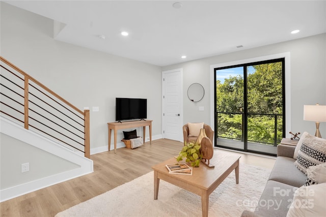 3449 Byrnes St, Charlotte, NC 28205 - living area with stairs, light wood-style flooring, recessed lighting, and baseboards