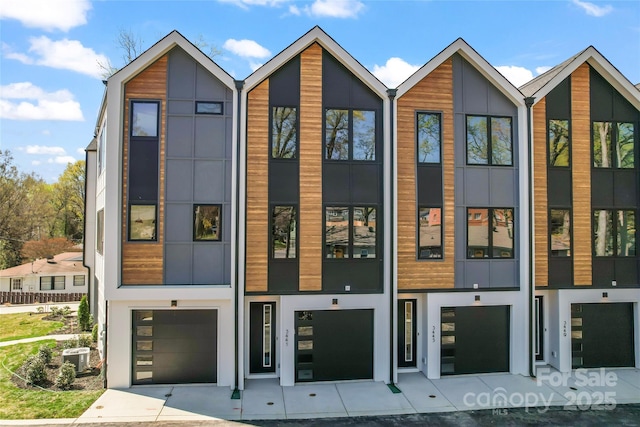 3449 Byrnes St, Charlotte, NC 28205 - contemporary house featuring a garage, stucco siding, and central AC unit
