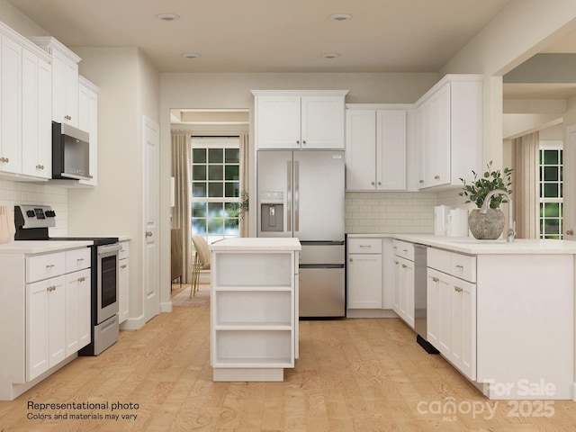 1512 Croydon St, Indian Land, SC 29707 - kitchen with open shelves, appliances with stainless steel finishes, a sink, light wood-style floors, and recessed lighting