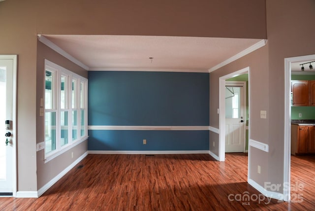 204 Foley Dr, Garner, NC 27529 - unfurnished room with wood finished floors, baseboards, and ornamental molding