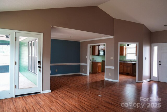 204 Foley Dr, Garner, NC 27529 - interior space with a ceiling fan, baseboards, high vaulted ceiling, and dark wood-type flooring